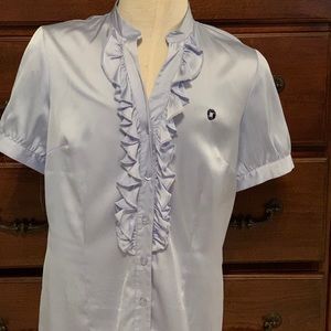 Blouse , sky blue with ruffle down the front.